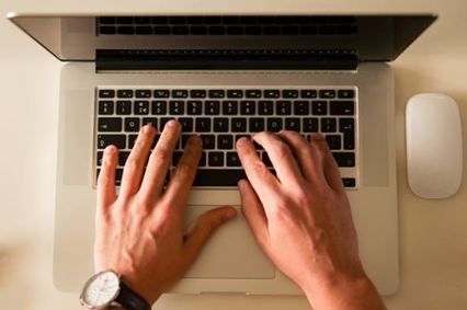 Person typing on a laptop