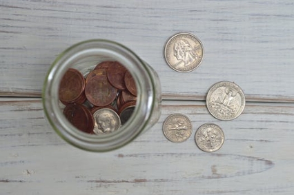 A tip jar with coins