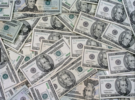 U.S. dollar bills laid out flat on a table