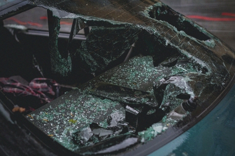 A car wreck after a crash with shattered windshield